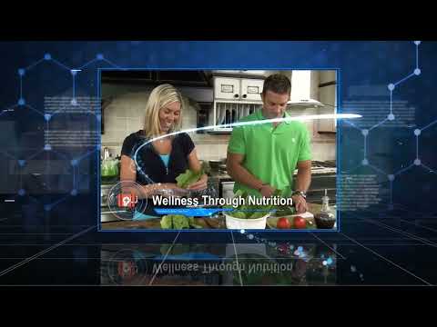 People in a kitchen preparing healthy meals emphasizing wellness through nutrition.